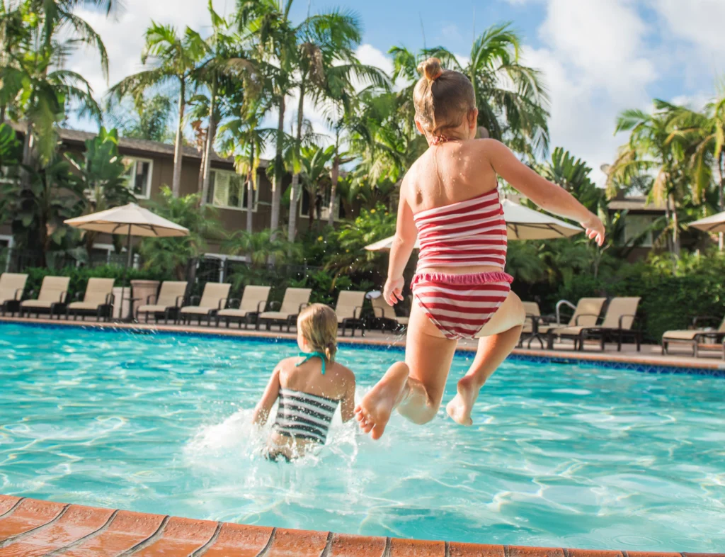kids jumping in the pool