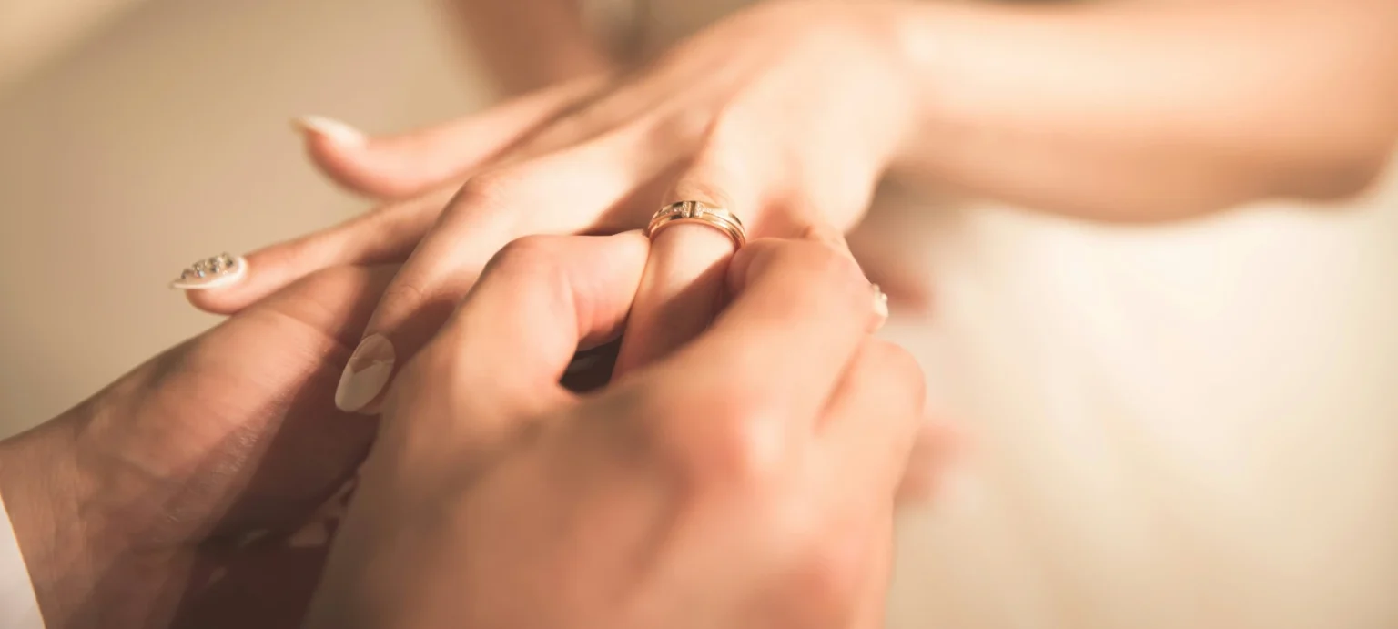 Ring being placed on bride's finger