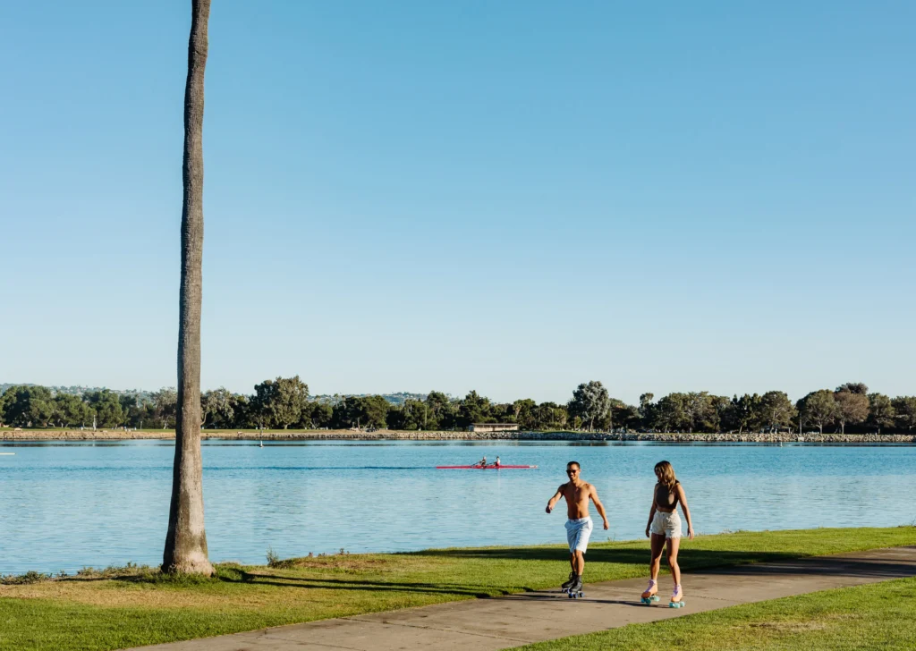 two people rollerskating on the waterfront