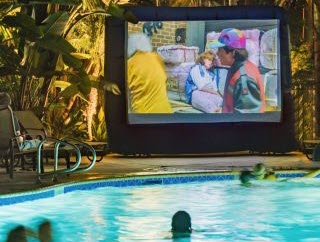 pool-side screen showing a movie