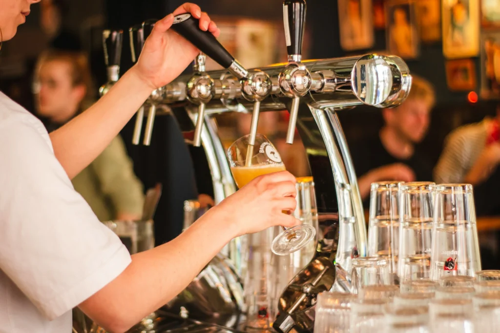 a beer being poured at oktoberfest