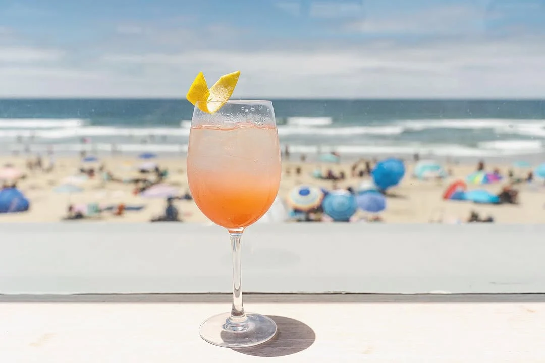 cocktail on a table overlooking ocean