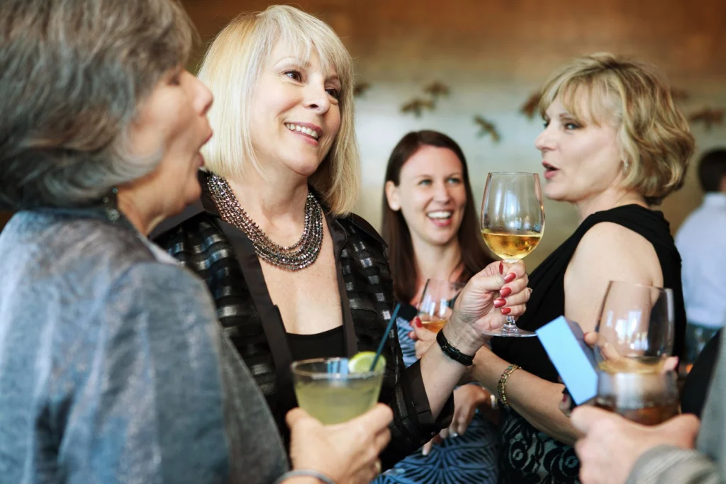 women standing a group setting