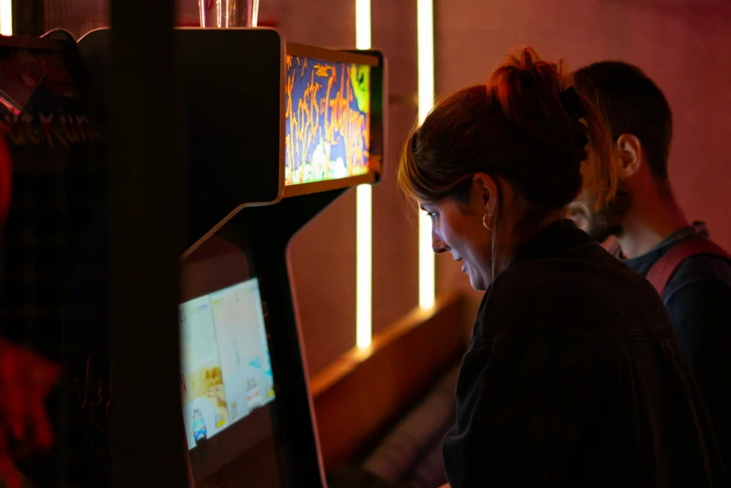 a couple playing an arcade game