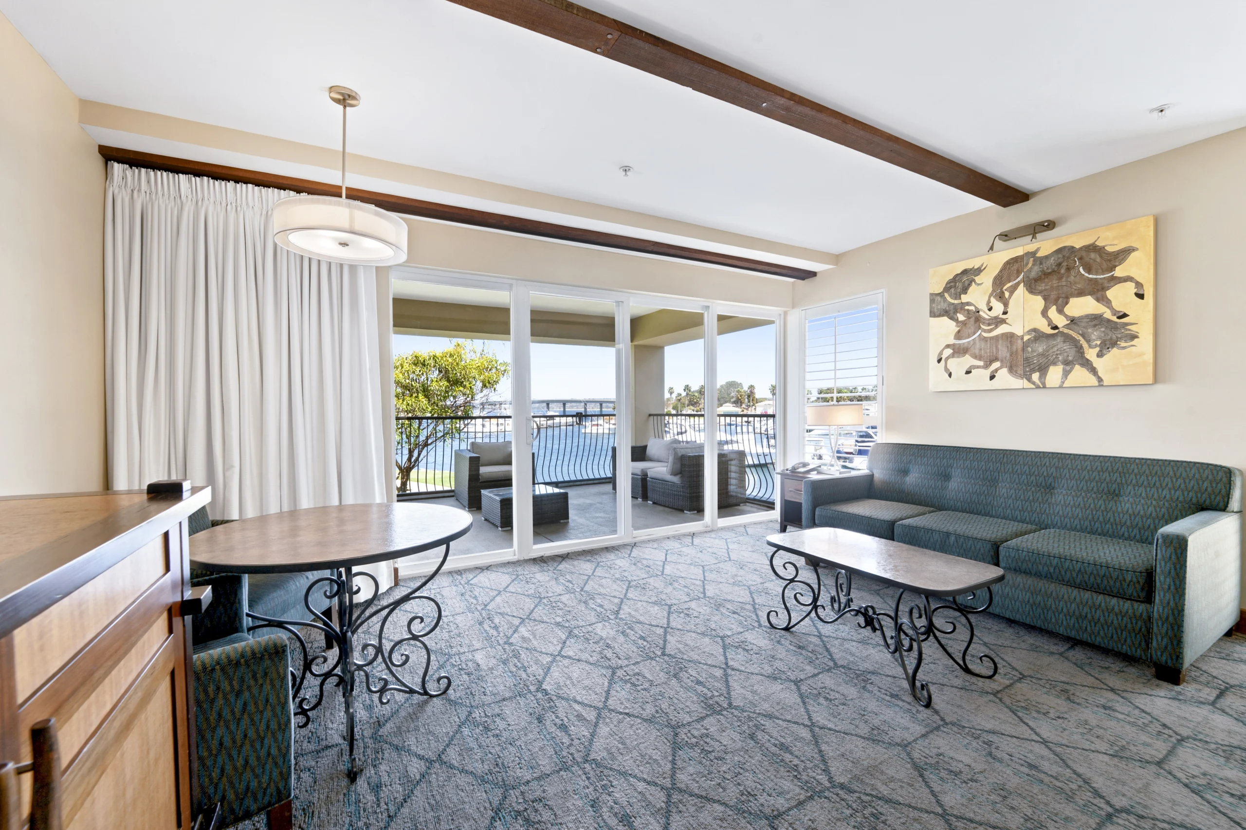 living room and balcony in deck queen suite at The Dana on Mission Bay San Diego