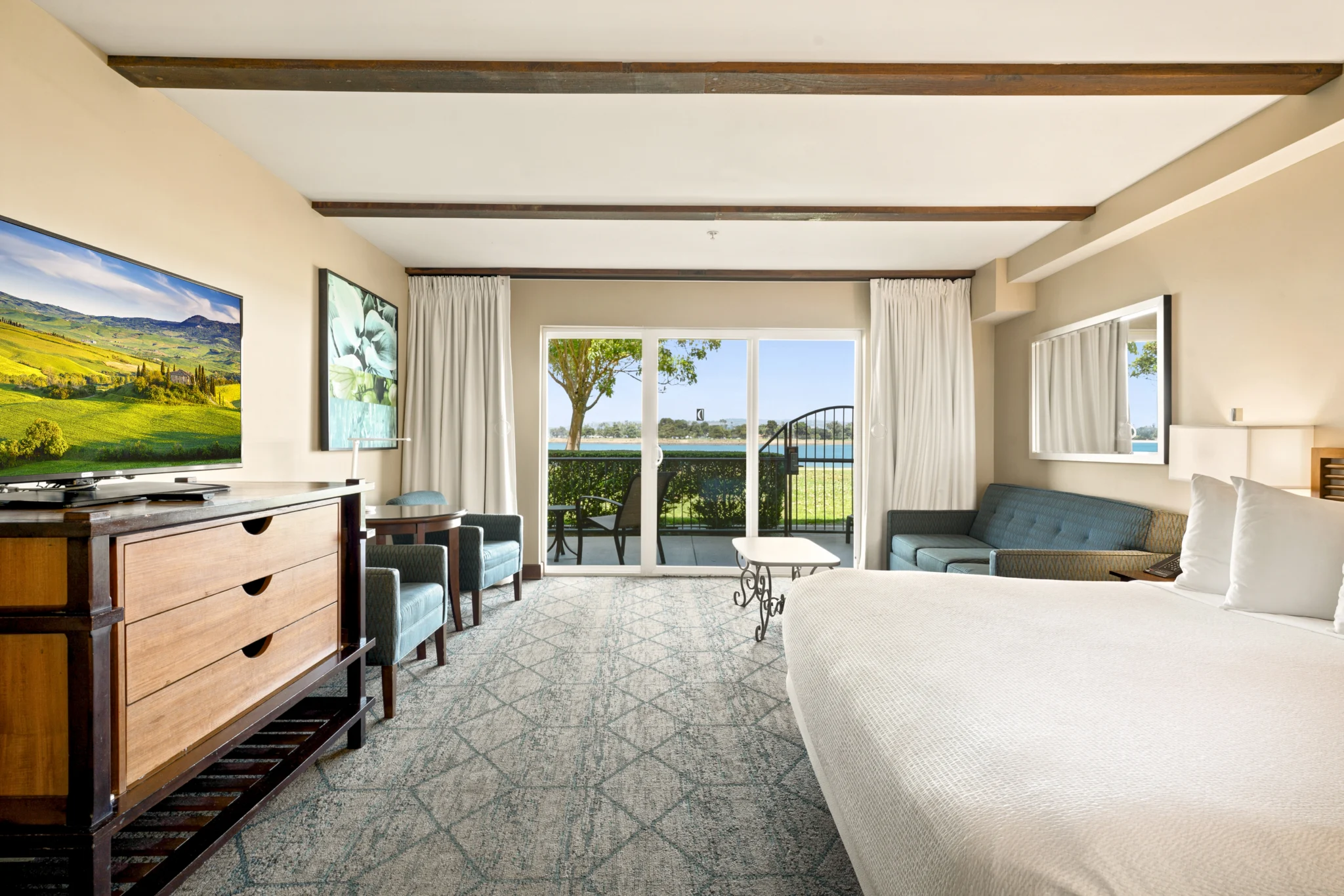king bed and patio in Bay View Accessible Suite at The Dana on Mission Bay San Diego