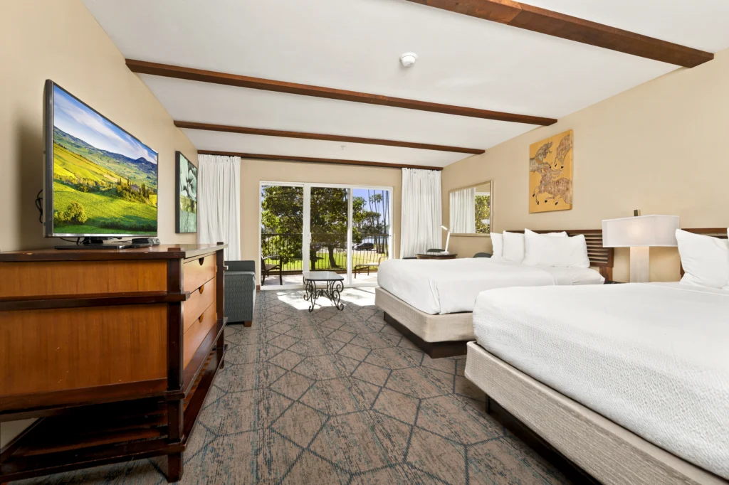 Two queen beds & living room sofa in Park View Queen Jr Suite at The Dana on Mission Bay Hotel San Diego