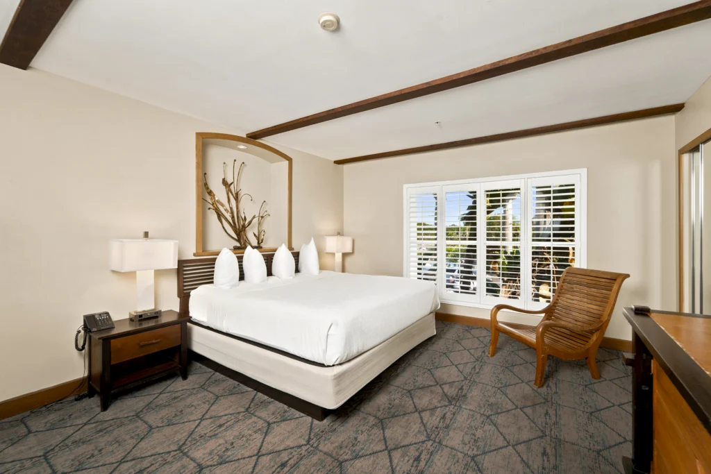 king bed in bedroom in Executive King Spa Suite at The Dana on Mission Bay San Diego
