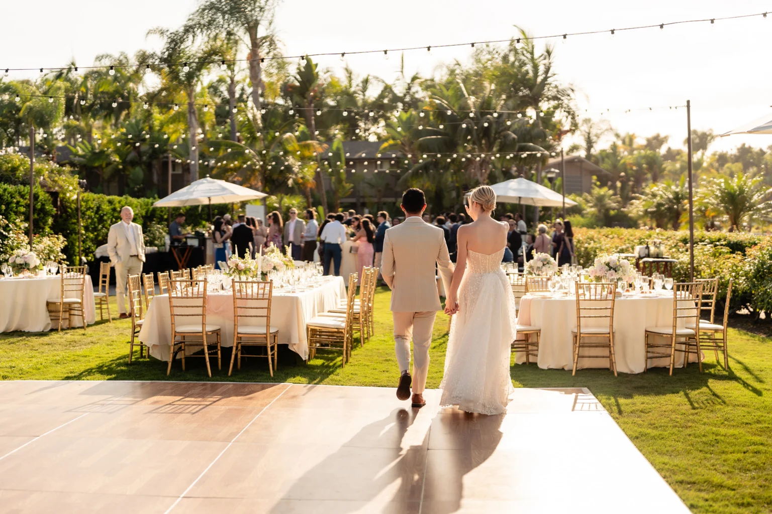 couple walking on dancefloor at wedding reception